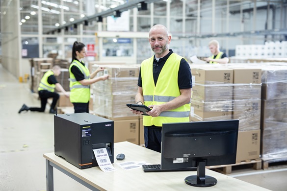 Warehouse workers using Brother TJ printer in a warehouse